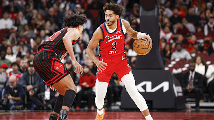 Dec 14, 2025; Chicago, Illinois, USA; New Orleans Pelicans guard Jordan Poole (3) brings the ball up court against Chicago Bulls guard Tre Jones (30) during the second half at United Center. Mandatory Credit: Kamil Krzaczynski-Imagn Images
