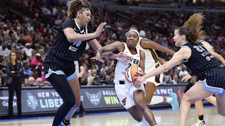 Jul 27, 2025; Chicago, Illinois, USA; Indiana Fever guard Aari McDonald (2) drives to the basket against the Chicago Sky during the first half at United Center. Mandatory Credit: Kamil Krzaczynski-Imagn Images