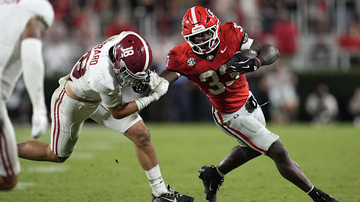 Sep 27, 2025; Athens, Georgia, USA;  Georgia Bulldogs running back Chauncey Bowens (33) runs against Alabama Crimson Tide defensive back Bray Hubbard (18) in the second half at Sanford Stadium. Mandatory Credit: Dale Zanine-Imagn Images