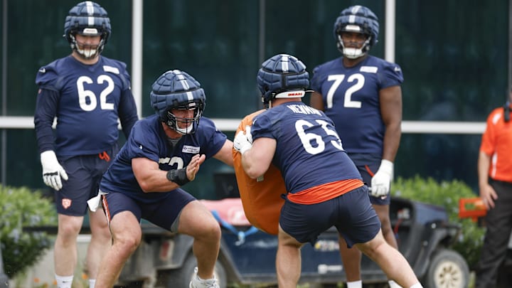 Drew Dalman blocks against padded-up guard Luke Newman during offseason drills at Halas Hall.