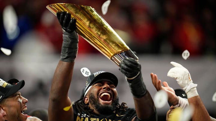 Ohio State Buckeyes offensive lineman Donovan Jackson (74) holds the trophy following the 34-23 win over the Notre Dame Fighting Irish to win the College Football Playoff National Championship at Mercedes-Benz Stadium in Atlanta on Jan. 21, 2025. Ohio State Buckeyes offensive lineman Donovan Jackson (74) holds the trophy following the 34-23 win over the Notre Dame Fighting Irish to win the College Football Playoff National Championship at Mercedes-Benz Stadium in Atlanta on Jan. 21, 2025.