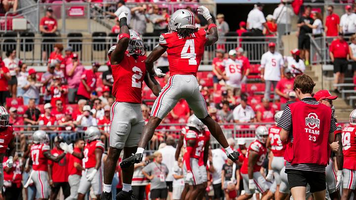 Ohio State Buckeyes defensive end Kenyatta Jackson Jr. (2) leaps into wide receiver Jeremiah Smith (4) during warm ups prior to the NCAA football game against the Ball State Cardinals at Ohio Stadium in Columbus on Sept. 5, 2026. Ohio State won 56-3. Ohio State Buckeyes defensive end Kenyatta Jackson Jr. (2) leaps into wide receiver Jeremiah Smith (4) during warm ups prior to the NCAA football game against the Ball State Cardinals at Ohio Stadium in Columbus on Sept. 5, 2026. Ohio State won 56-3.