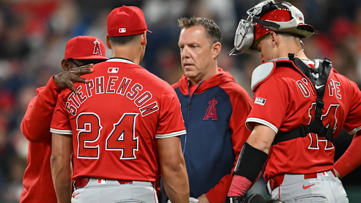 May 30, 2025; Cleveland, Ohio, USA; Los Angeles Angels relief pitcher Robert Stephenson (24) is looked at by a trainer after being injured during the seventh inning against the Cleveland Guardians at Progressive Field. Mandatory Credit: Ken Blaze-Imagn Images May 30, 2025; Cleveland, Ohio, USA; Los Angeles Angels relief pitcher Robert Stephenson (24) is looked at by a trainer after being injured during the seventh inning against the Cleveland Guardians at Progressive Field. Mandatory Credit: Ken Blaze-Imagn Images