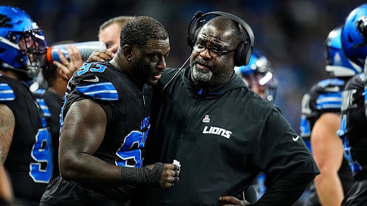 Detroit Lions defensive line coach Terrell Williams talks to defensive end Josh Paschal during the first half against Seattle Seahawks at Ford Field in Detroit on Monday, Sept. 30, 2024.