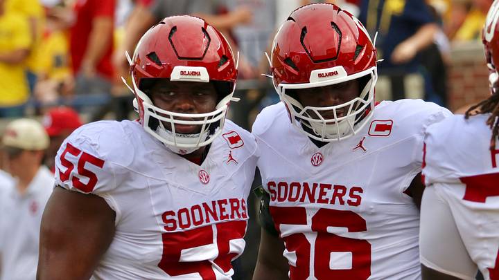 Oklahoma offensive linemen Eddy Pierre-Louis and Michael Fasusi warm up before facing Michigan.