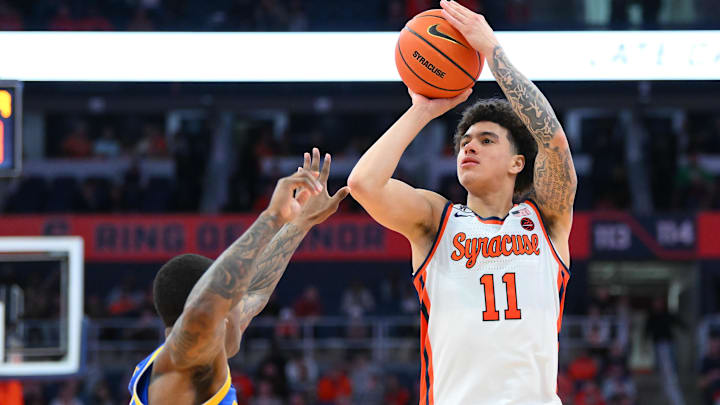 Mar 7, 2026; Syracuse, New York, USA; Syracuse Orange guard Naithan George (11) shoots against Pittsburgh Panthers guard Damarco Minor (left) during the second half at the JMA Wireless Dome. Mandatory Credit: Rich Barnes-Imagn Images