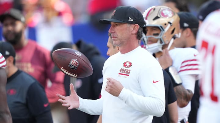 Nov 2, 2025; East Rutherford, New Jersey, USA; San Francisco 49ers head coach Kyle Shanahan tosses a football in the air during warm ups prior to a game against the New York Giants at MetLife Stadium. Mandatory Credit: Robert Deutsch-Imagn Images