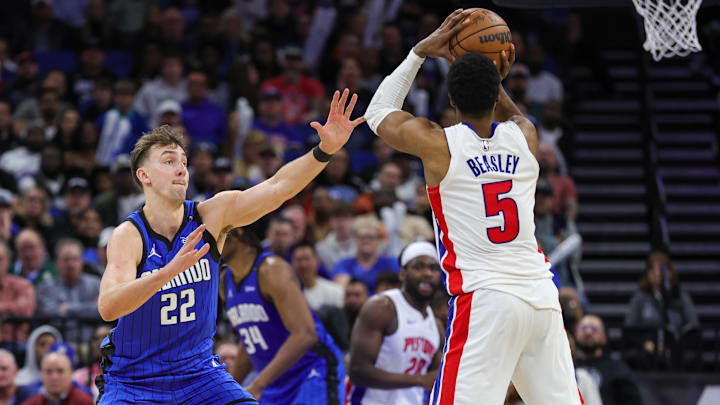 Jan 25, 2025; Orlando, Florida, USA; Orlando Magic forward Franz Wagner (22) defends against Detroit Pistons guard Malik Beasley (5) : Mike Watters-Imagn Images