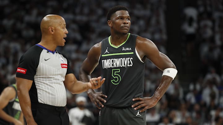 May 30, 2024; Minneapolis, Minnesota, USA; NBA referee Marc Davis (8) talks to Minnesota Timberwolves guard Anthony Edwards (5) during the second quarter in game five of the western conference finals for the 2024 NBA playoffs against the Dallas Mavericks at Target Center.