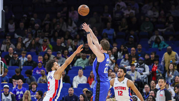 Jan 25, 2025; Orlando, Florida, USA; Orlando Magic forward Franz Wagner (22) shoots against Detroit Pistons guard Cade Cunningham (2) during the first quarter at Kia Center. Mandatory Credit: Mike Watters-Imagn Images