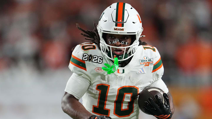 Jan 19, 2026; Miami Gardens, FL, USA; Miami Hurricanes wide receiver Malachi Toney (10) runs with the ball against the Indiana Hoosiers during the second half of the College Football Playoff National Championship game at Hard Rock Stadium. Mandatory Credit: Kirby Lee-Imagn Images