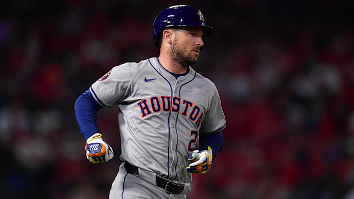 Sep 13, 2024; Anaheim, California, USA; Houston Astros third baseman Alex Bregman (2) hits a single against the Los Angeles Angels during the seventh inning at Angel Stadium. 