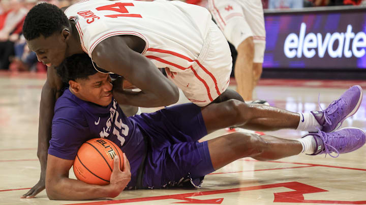 Feb 14, 2026; Houston, Texas, USA; Kansas State Wildcats forward Taj Manning (15) and Houston Cougars forward Kalifa Sakho (14) go after a loose ball in the second half at Fertitta Center. 