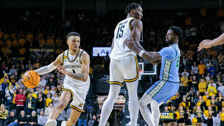 Feb 23, 2025; Wichita, Kansas, USA; Wichita State Shockers guard Xavier Bell (1) drives to the basket during the second half against the Tulane Green Wave at Charles Koch Arena.