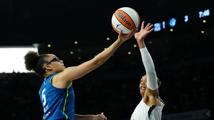 Aug 15, 2026; Las Vegas, Nevada, USA; Minnesota Lynx guard Olivia Miles (5) shoots against Las Vegas Aces center A'ja Wilson (22) in the first quarter at Michelob Ultra Arena. Mandatory Credit: Candice Ward-Imagn Images