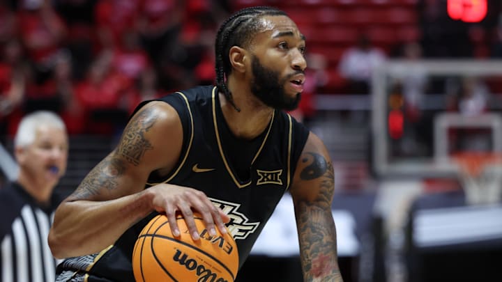 Feb 21, 2026; Salt Lake City, Utah, USA; UCF Knights forward Jordan Burks (99) looks for the play against the Utah Utes during the first half at Jon M. Huntsman Center. Mandatory Credit: Rob Gray-Imagn Images