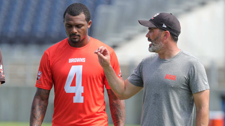 Quarterback Deshaun Watson, talking with coach Kevin Stefanski at a 2022 minicamp session, has only played in 19 of the Browns' 52 games since being acquired from the Texans in 2022.