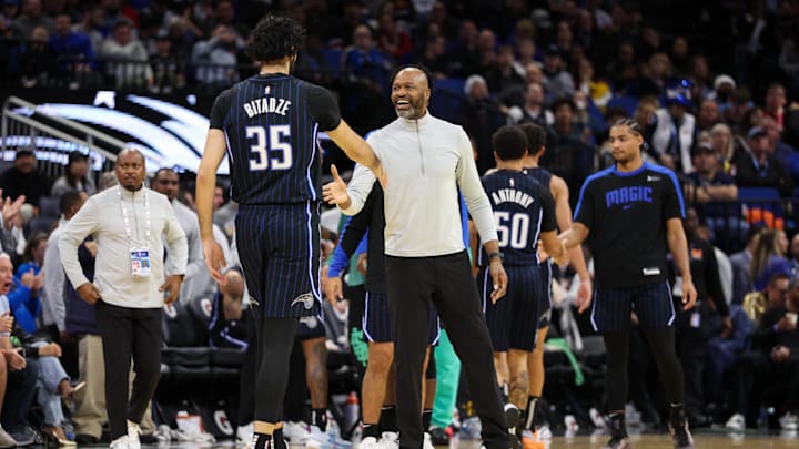 Orlando Magic center Goga Bitadze (35) celebrates with head coach Jamahl Mosley after a play against the Miami Heat in the third quarter at Kia Center.