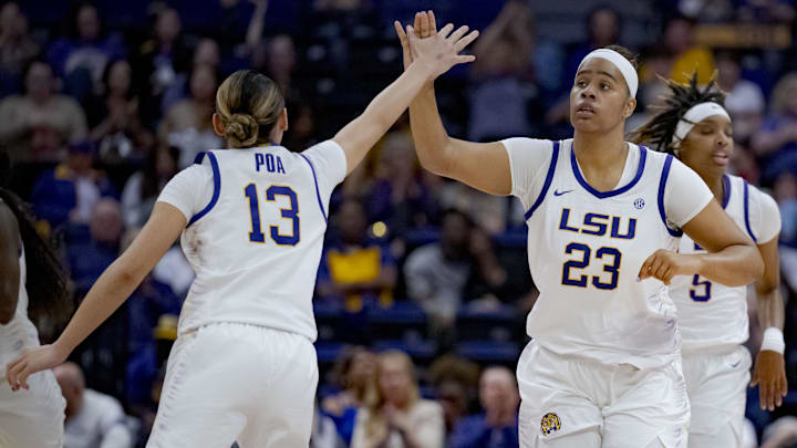 Nov 20, 2023; Baton Rouge, Louisiana, USA;  LSU Lady Tigers center Aalyah Del Rosario (23) celebrates a basket with LSU Lady Tigers guard Last-Tear Poa (13) during the second half against the Texas Southern Lady Tigers at the Pete Maravich Assembly Center. Mandatory Credit: Matthew Hinton-Imagn Images