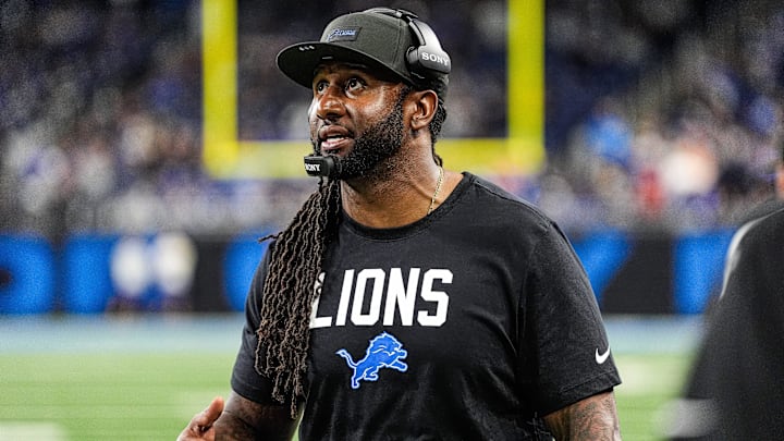 Detroit Lions defensive coordinator Kelvin Sheppard watches a replay against Tampa Bay Buccaneers during the second half at Ford Field in Detroit on Monday, Oct. 20, 2025.