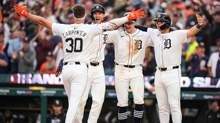 Detroit Tigers designated hitter Kerry Carpenter (30), left, celebrates with teammates center fielder Parker Meadows (22), shortstop Trey Sweeney (27) and first base Spencer Torkelson (20) after batting a grand slam against Chicago White Sox during the fifth inning at Comerica Park in Detroit on Sunday, Sept. 29, 2024. Detroit Tigers designated hitter Kerry Carpenter (30), left, celebrates with teammates center fielder Parker Meadows (22), shortstop Trey Sweeney (27) and first base Spencer Torkelson (20) after batting a grand slam against Chicago White Sox during the fifth inning at Comerica Park in Detroit on Sunday, Sept. 29, 2024.