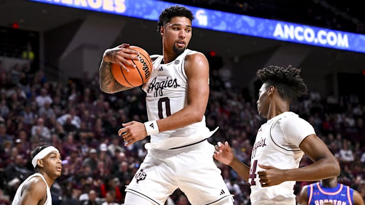 Dec 20, 2024; College Station, Texas, USA; Texas A&M Aggies guard Jace Carter (0) secures the rebound /during the second half against the Houston Christian Huskies at Reed Arena. The Aggies defeated the Huskies 77-45. Mandatory Credit: Maria Lysaker-Imagn Images 