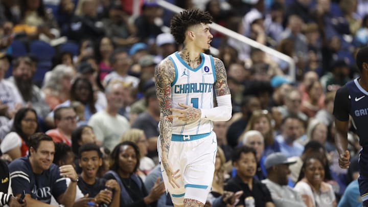 Oct 15, 2025; Greensboro, North Carolina, USA; Charlotte Hornets guard LaMelo Ball (1) celebrates after making a three-poiunt basket during the second half against the Memphis Grizzlies at First Horizon Coliseum. Mandatory Credit: Brian Westerholt-Imagn Images