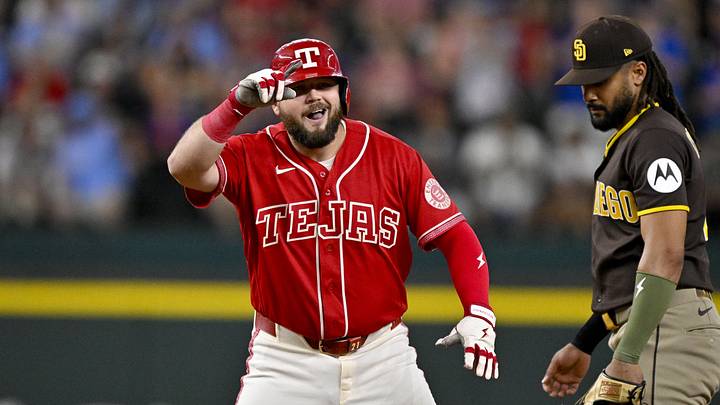 Jun 19, 2026; Arlington, Texas, USA; Texas Rangers first baseman Jake Burger (21) celebrates after he hits a double and drives in two runs against the San Diego Padres during the first inning at Globe Life Field. Mandatory Credit: Jerome Miron-Imagn Images