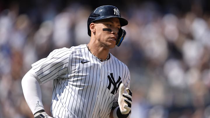 New York Yankees right fielder Aaron Judge (99) rounds the bases after hitting a two run home run for his 350th home run against the Chicago Cubs during the ninth inning at Yankee Stadium.