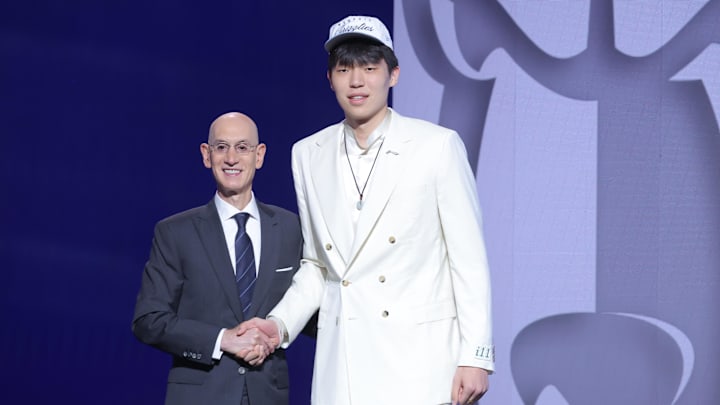 Jun 25, 2025; Brooklyn, NY, USA; Yang Hansen stands with NBA commissioner Adam Silver after being selected as the 16th pick by the Memphis Grizzlies in the first round of the 2025 NBA Draft at Barclays Center. Mandatory Credit: Brad Penner-Imagn Images Jun 25, 2025; Brooklyn, NY, USA; Yang Hansen stands with NBA commissioner Adam Silver after being selected as the 16th pick by the Memphis Grizzlies in the first round of the 2025 NBA Draft at Barclays Center. Mandatory Credit: Brad Penner-Imagn Images