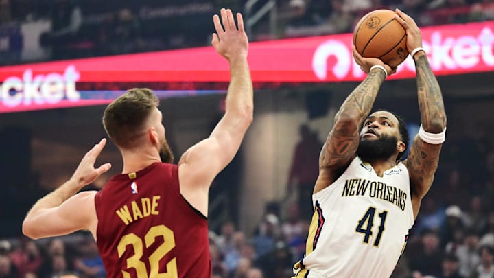 Dec 23, 2025; Cleveland, Ohio, USA; New Orleans Pelicans guard Saddiq Bey (41) shoots over the defense of  Cleveland Cavaliers forward Dean Wade (32) during the first quarter at Rocket Arena. Mandatory Credit: Ken Blaze-Imagn Images