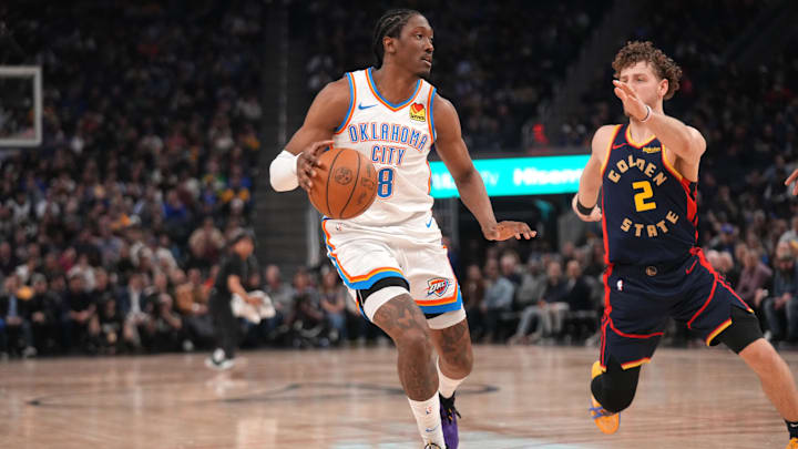 Jan 29, 2025; San Francisco, California, USA; Oklahoma City Thunder guard Jalen Williams (8) dribbles the ball next to Golden State Warriors guard Brandin Podziemski (2) in the second quarter at the Chase Center. Mandatory Credit: Cary Edmondson-Imagn Images