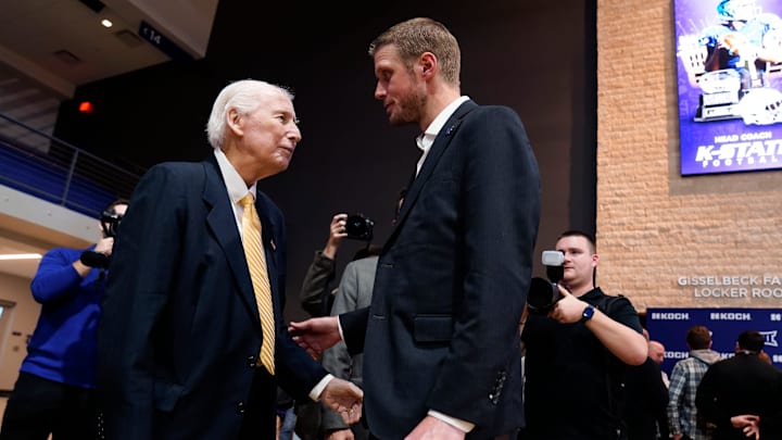 Kansas State new head football coach Collin Klein talks with former football coach Bill Snyder during his introduction ceremony at Morgan Family Arena on Dec. 5, 2025.