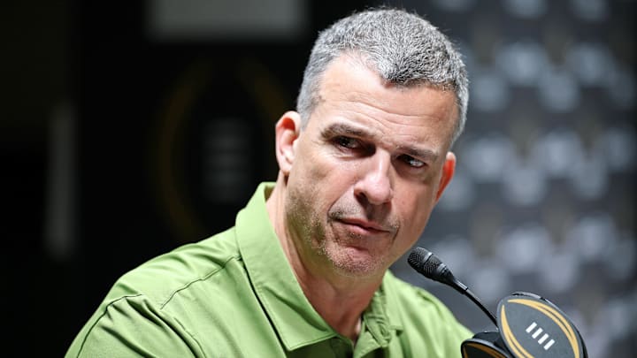 Jan 17, 2026; Miami Gardens, FL, USA; Miami Hurricanes head coach Mario Cristobal talks to the media during media day for the 2025 College Football Playoff National Championship at Miami Beach Convention Center. Mandatory Credit: Nathan Ray Seebeck-Imagn Images Jan 17, 2026; Miami Gardens, FL, USA; Miami Hurricanes head coach Mario Cristobal talks to the media during media day for the 2025 College Football Playoff National Championship at Miami Beach Convention Center. Mandatory Credit: Nathan Ray Seebeck-Imagn Images