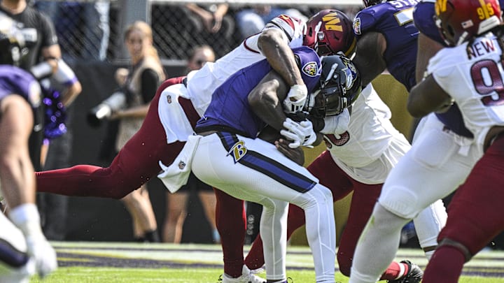 Washington Commanders linebacker Dante Fowler Jr. sacks Baltimore Ravens quarterback Lamar Jackson.