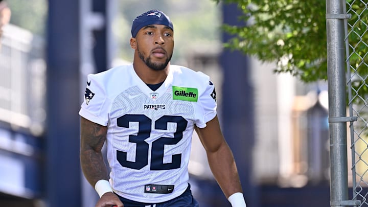Jul 23, 2025; Foxborough, MA, USA; New England Patriots running back TreVeyon Henderson (32) walks to the practice field for training camp at Gillette Stadium. Mandatory Credit: Eric Canha-Imagn Images