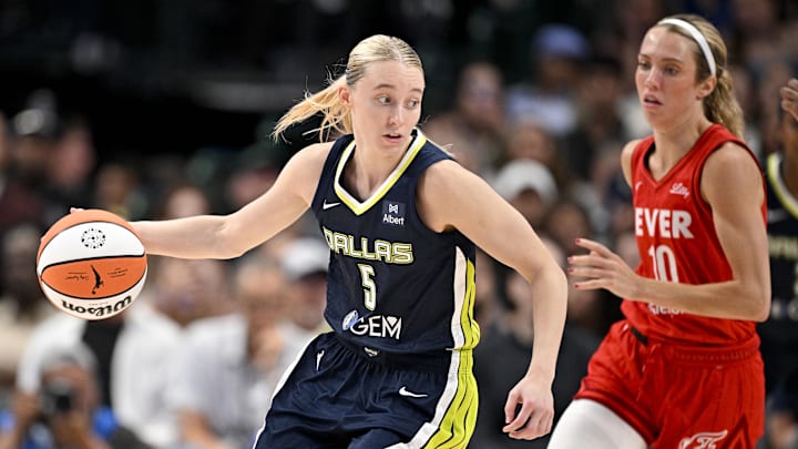 Jun 27, 2025; Dallas, Texas, USA; Dallas Wings guard Paige Bueckers (5) controls the ball Indiana Fever guard Lexie Hull (10) during the second half at the American Airlines Center. Mandatory Credit: Jerome Miron-Imagn Images
