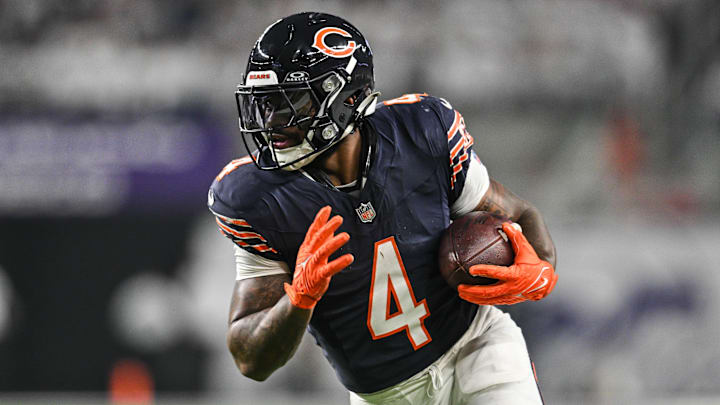 Dec 16, 2024; Minneapolis, Minnesota, USA; Chicago Bears running back D'Andre Swift (4) runs the ball against the Minnesota Vikings during the third quarter at U.S. Bank Stadium. Mandatory Credit: Jeffrey Becker-Imagn Images