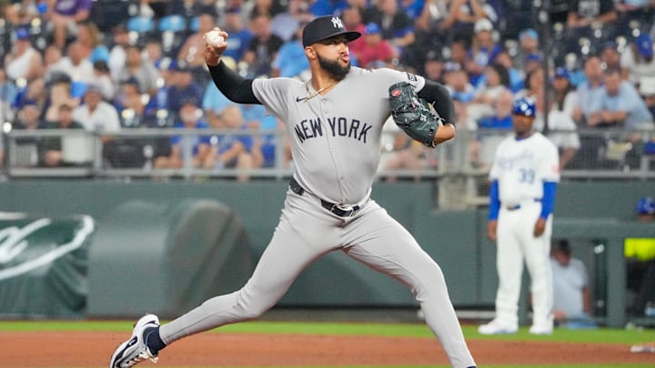 Jun 12, 2025; Kansas City, Missouri, USA; New York Yankees relief pitcher Devin Williams (38) delivers a pitch against the Kansas City Royals in the ninth inning at Kauffman Stadium. Mandatory Credit: Denny Medley-Imagn Images