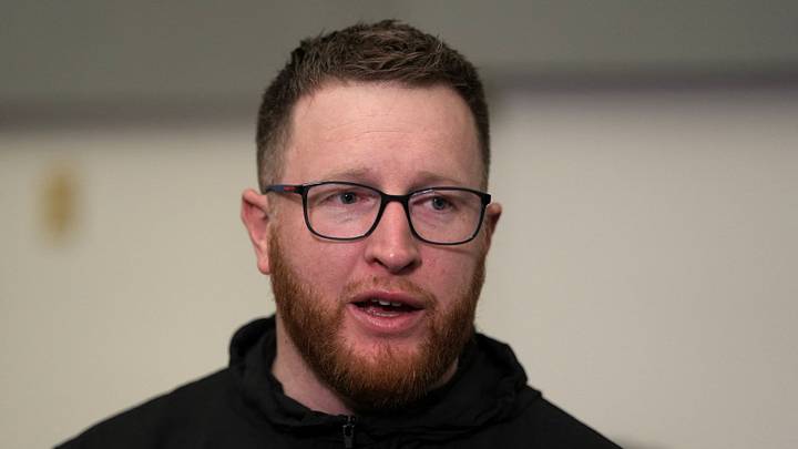Seattle Seahawks special teams coordinator Jay Harbaugh talks to media members