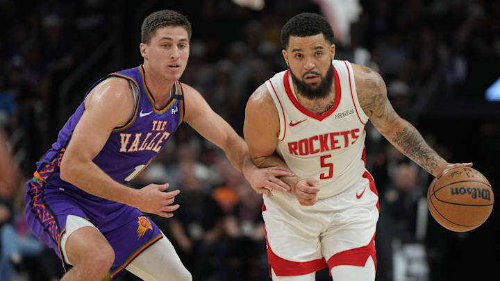 Mar 30, 2025; Phoenix, Arizona, USA; Houston Rockets guard Fred VanVleet (5) drives past Phoenix Suns guard Collin Gillespie (12) in the first half at Footprint Center. Mandatory Credit: Rick Scuteri-Imagn Images