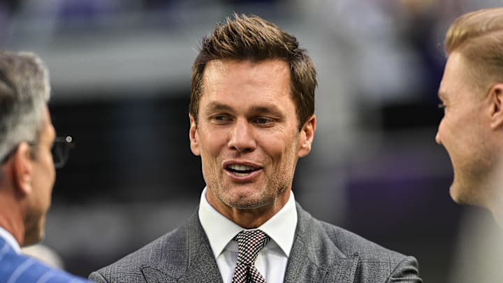 Dec 29, 2024; Minneapolis, Minnesota, USA; FOX broadcaster and former NFL quarterback Tom Brady looks on before the game between the Minnesota Vikings and the Green Bay Packers at U.S. Bank Stadium. Mandatory Credit: Jeffrey Becker-Imagn Images Dec 29, 2024; Minneapolis, Minnesota, USA; FOX broadcaster and former NFL quarterback Tom Brady looks on before the game between the Minnesota Vikings and the Green Bay Packers at U.S. Bank Stadium. Mandatory Credit: Jeffrey Becker-Imagn Images