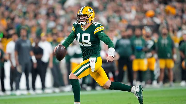 Aug 28, 2026; Green Bay, Wisconsin, USA;  Green Bay Packers quarterback Kyle McCord (18) rushes with the football during the fourth quarter against the Arizona Cardinals at Lambeau Field. Mandatory Credit: Jeff Hanisch-Imagn Images