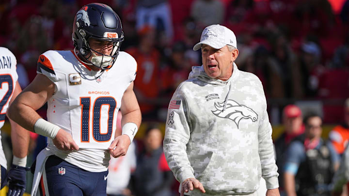Nov 10, 2024; Kansas City, Missouri, USA; Denver Broncos quarterback Bo Nix (10) talks with head coach Sean Payton against the Kansas City Chiefs prior to a game at GEHA Field at Arrowhead Stadium. 