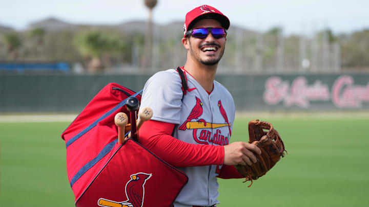 Feb 17, 2025; Jupiter, FL, USA;  St. Louis Cardinals third base Nolan Arenado (28) laughs as he heads off to a workout station at spring training.