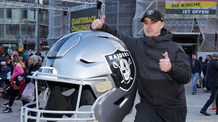 Nov 11, 2023; Frankfurt, Germany; A fan poses with large Las Vegas Raiders helmet at the NFL