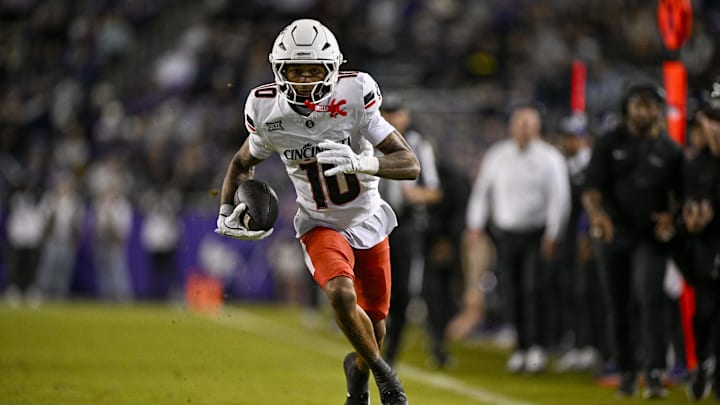 Nov 29, 2025; Fort Worth, Texas, USA; Cincinnati Bearcats wide receiver Caleb Goodie (10) catches the ball and runs for a first down against the TCU Horned Frogs during the first half at Amon G. Carter Stadium. Mandatory Credit: Jerome Miron-Imagn Images