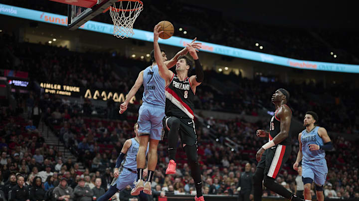 Mar 19, 2025; Portland, Oregon, USA; Portland Trail Blazers forward Deni Avdija (8) scores a basket during the second half against Memphis Grizzlies forward Santi Aldama (7) at Moda Center. Mandatory Credit: Troy Wayrynen-Imagn Images