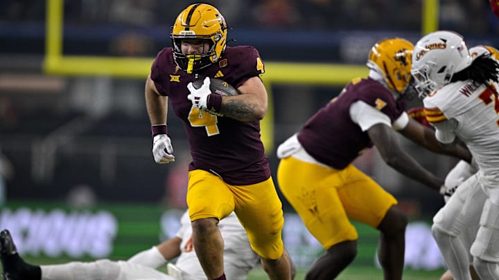 Dec 7, 2024; Arlington, TX, USA; Arizona State Sun Devils running back Cam Skattebo (4) scores a rushing touchdown against the Iowa State Cyclones during the second half at AT&T Stadium. 