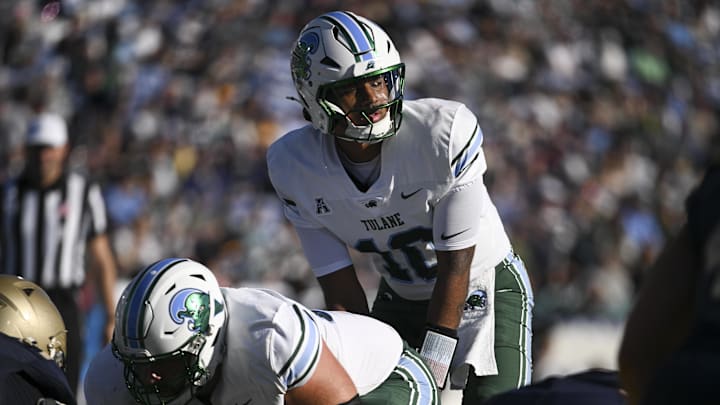 Nov 16, 2024; Annapolis, Maryland, USA; Tulane Green Wave quarterback Darian Mensah (10) calls a play at the line during the second half against the Navy Midshipmen at Navy-Marine Corps Memorial Stadium. Nov 16, 2024; Annapolis, Maryland, USA; Tulane Green Wave quarterback Darian Mensah (10) calls a play at the line during the second half against the Navy Midshipmen at Navy-Marine Corps Memorial Stadium.
